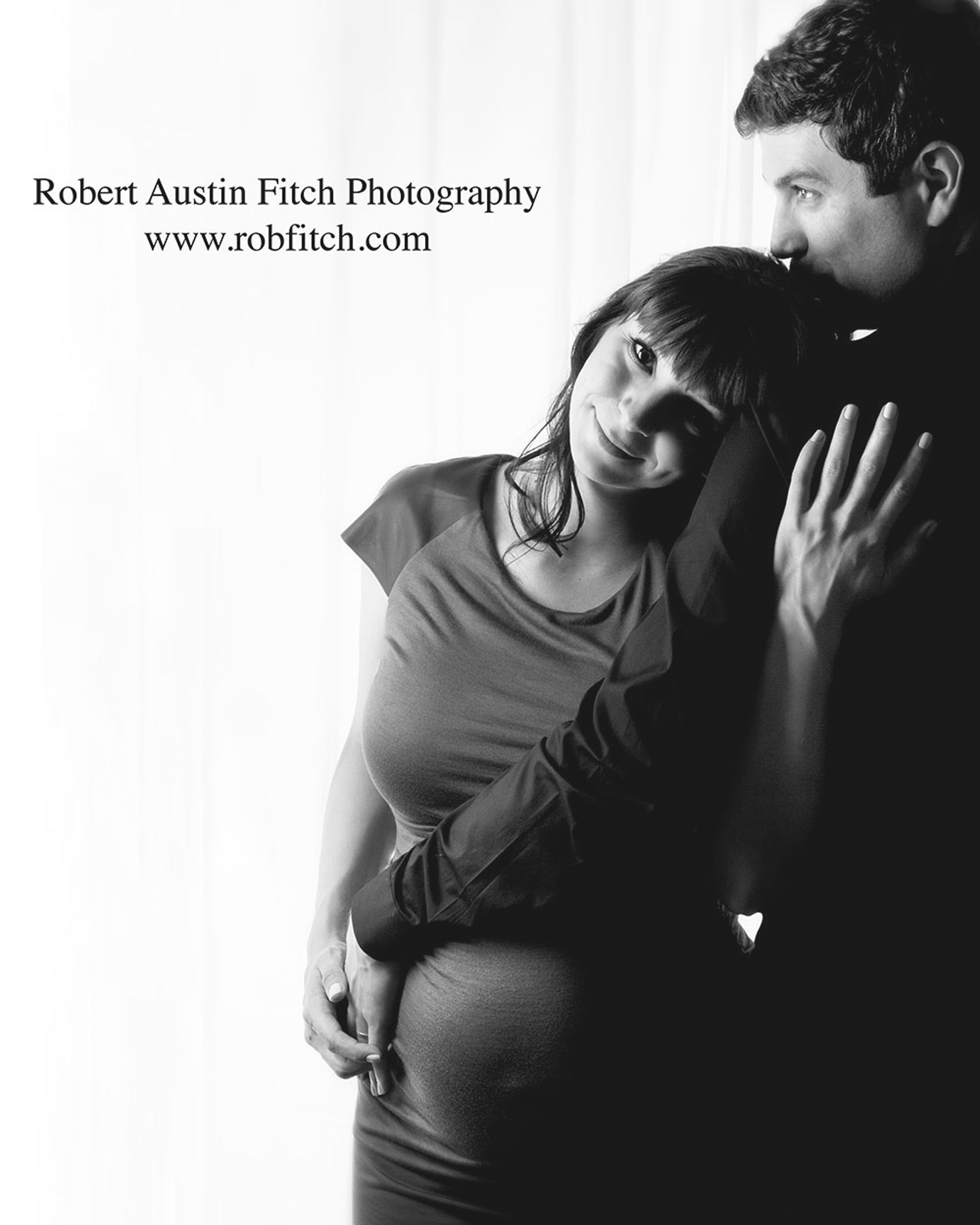 B&W maternity photo of pregnant woman and her husband. 