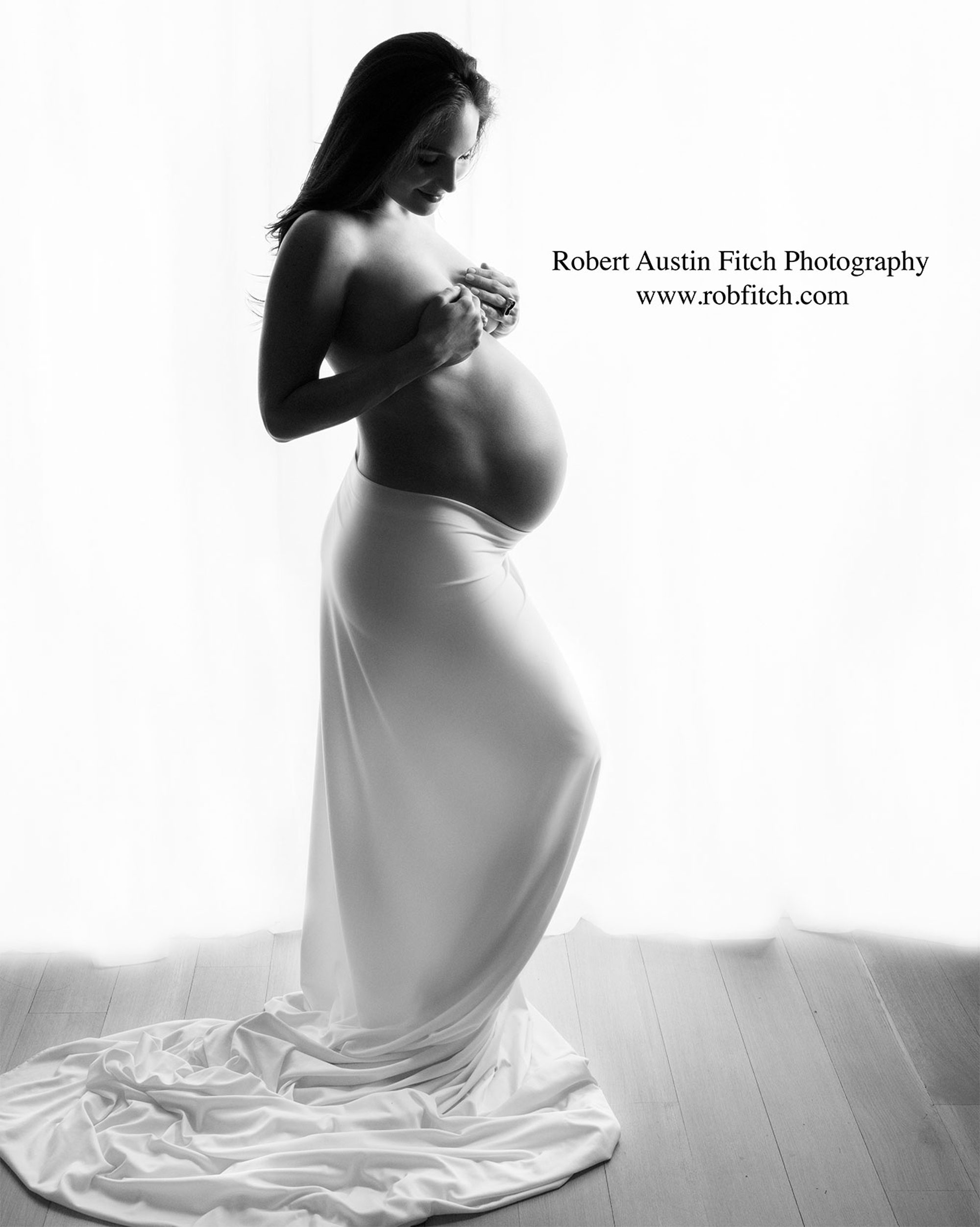 B&W Silhouette Maternity Photo of Pregnant Woman with White Fabric Draping