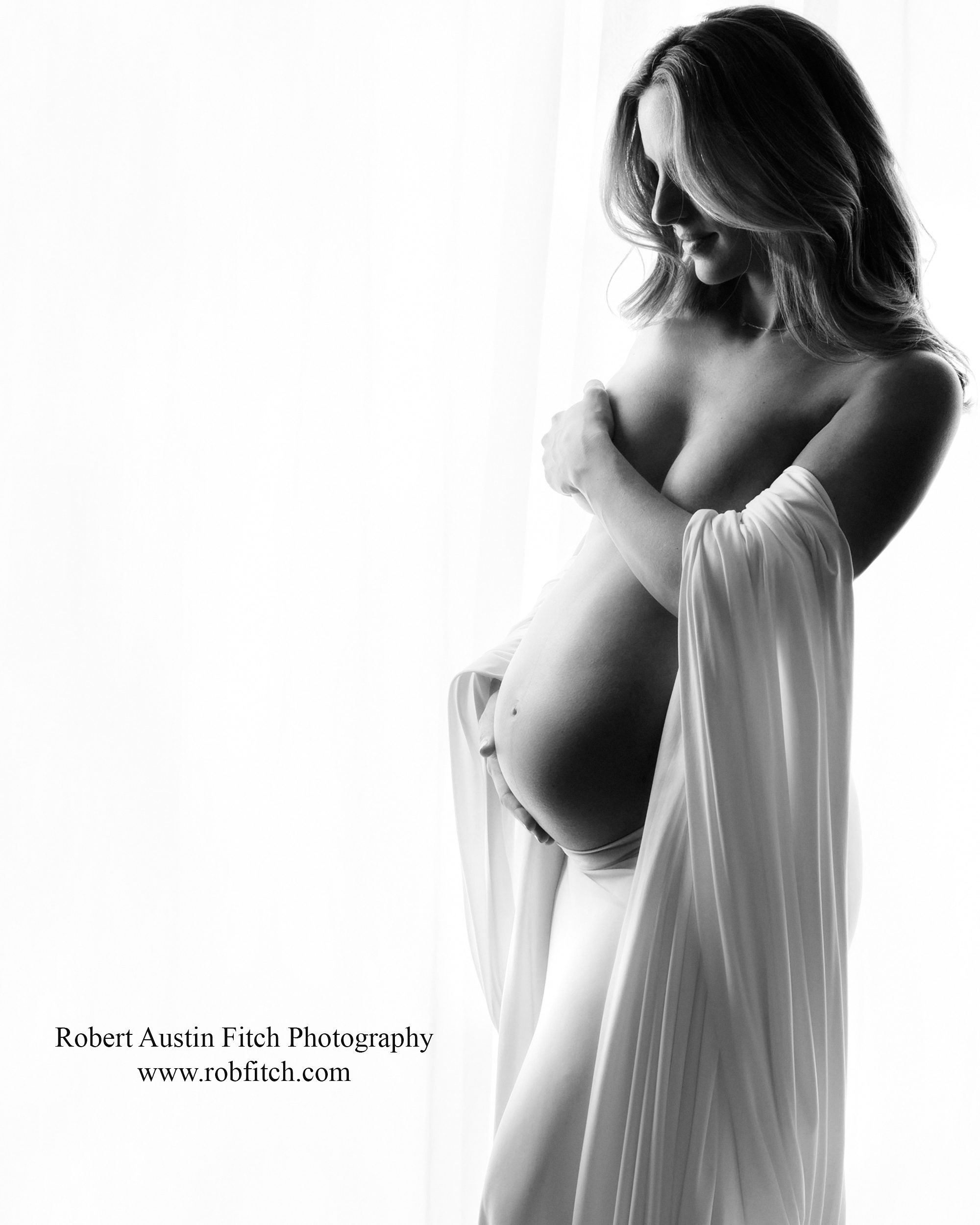 B&W Silhouette Maternity Photo with White Fabric Draping