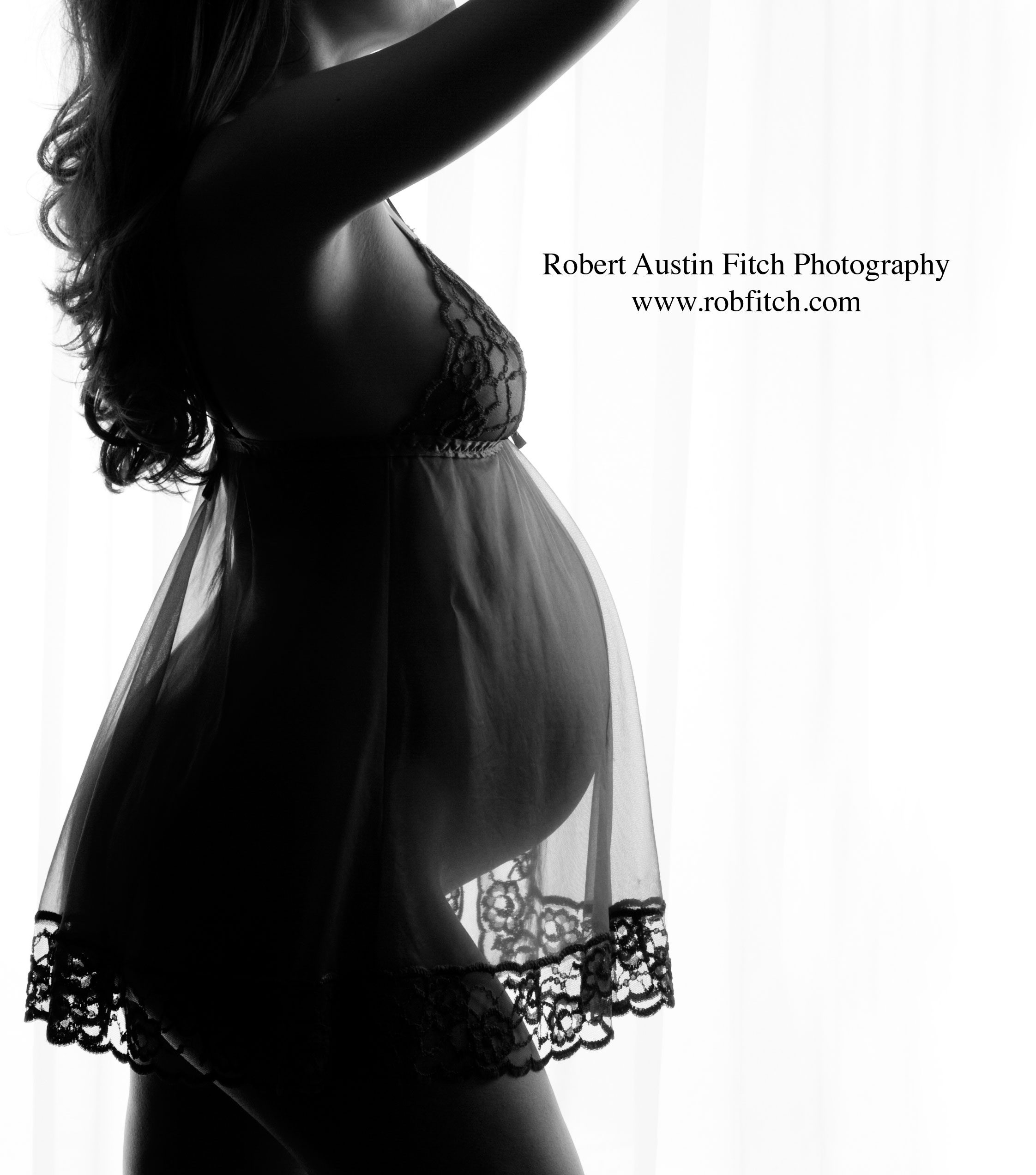 Fine Art B&W Silhouette Maternity Photo of Pregnant Woman in Sheer Black Negligee