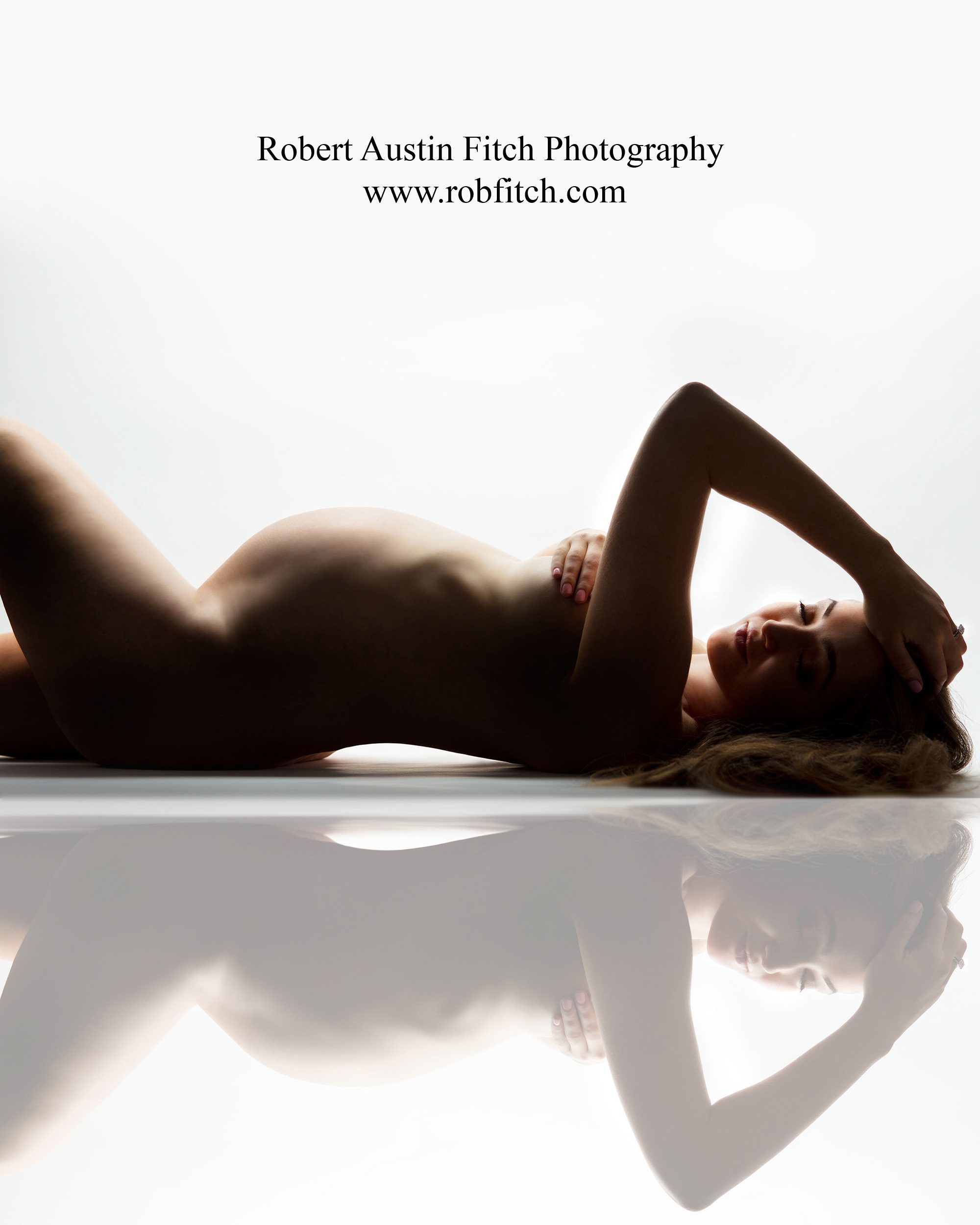 Artistic nude maternity photo with reflection